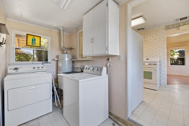 513 W Fountain Way, Fresno, CA 93705 - washroom featuring cabinet space, separate washer and dryer, and strapped water heater