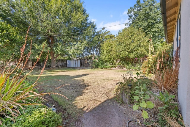 513 W Fountain Way, Fresno, CA 93705 - fenced backyard with a storage unit