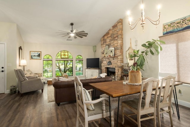 1620 Fir Ave, Clovis, CA 93611 - dining area featuring wood finished floors, ceiling fan, a fireplace, vaulted ceiling, and a chandelier