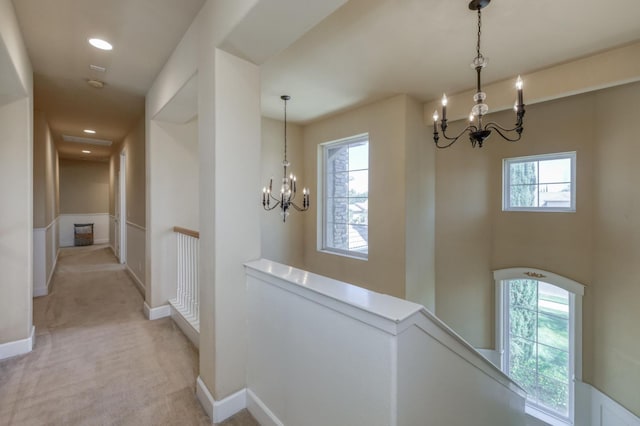 3016 San Gabriel Ave, Clovis, CA 93619 - hallway with a chandelier, an upstairs landing, light carpet, and recessed lighting