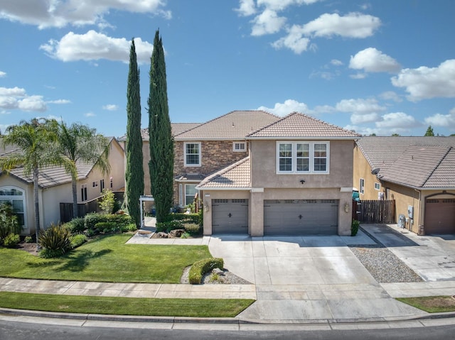 3016 San Gabriel Ave, Clovis, CA 93619 - view of front of home with a tile roof, stucco siding, concrete driveway, and a garage