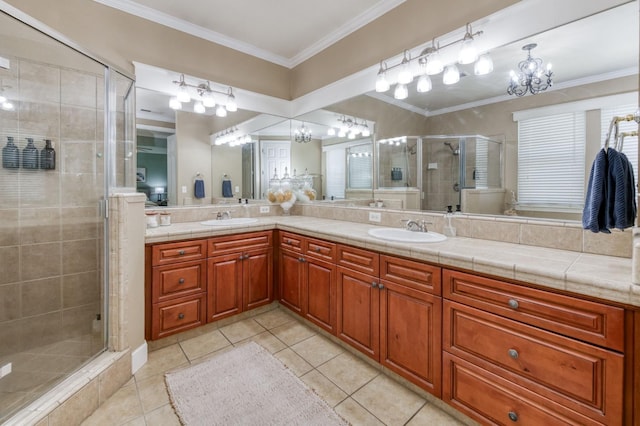 3016 San Gabriel Ave, Clovis, CA 93619 - bathroom with a chandelier, double vanity, tile patterned floors, a stall shower, and crown molding