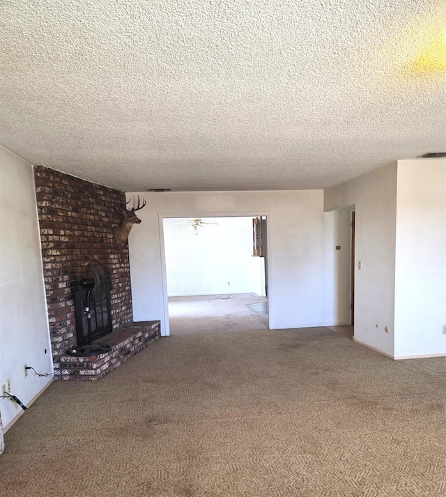 5525 S Fig Ave, Fresno, CA 93706 - unfurnished living room featuring carpet, a fireplace, a textured ceiling, and a ceiling fan