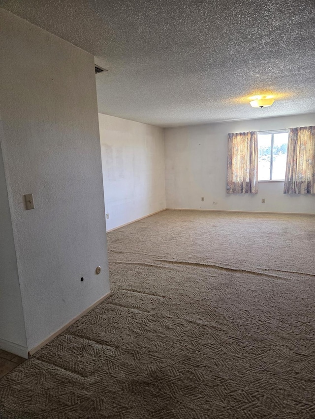 5525 S Fig Ave, Fresno, CA 93706 - carpeted empty room with a textured ceiling and baseboards