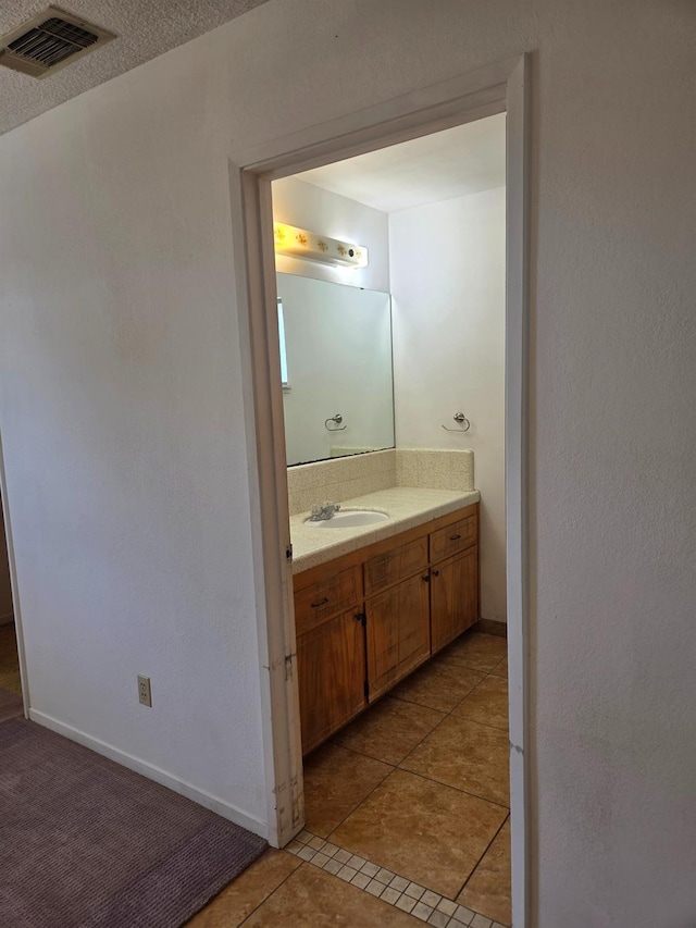 5525 S Fig Ave, Fresno, CA 93706 - bathroom featuring vanity and tile patterned floors