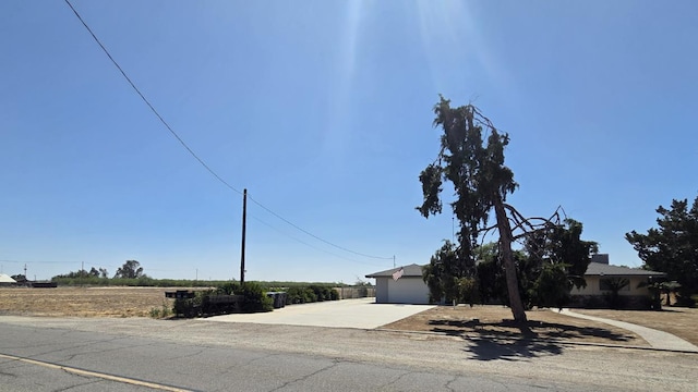 5525 S Fig Ave, Fresno, CA 93706 - obstructed view of property featuring driveway and a garage