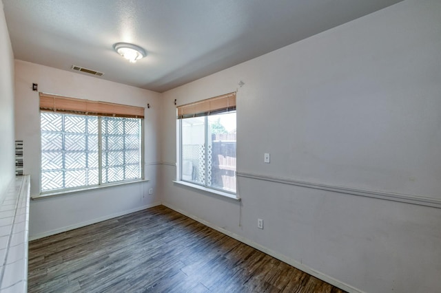 4665 W Yale Ave, Fresno, CA 93722 - empty room featuring wood finished floors and baseboards