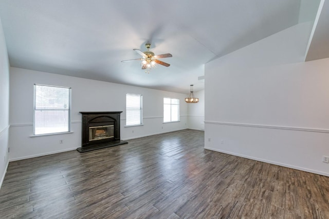 4665 W Yale Ave, Fresno, CA 93722 - unfurnished living room with a ceiling fan, a glass covered fireplace, dark wood finished floors, and a chandelier