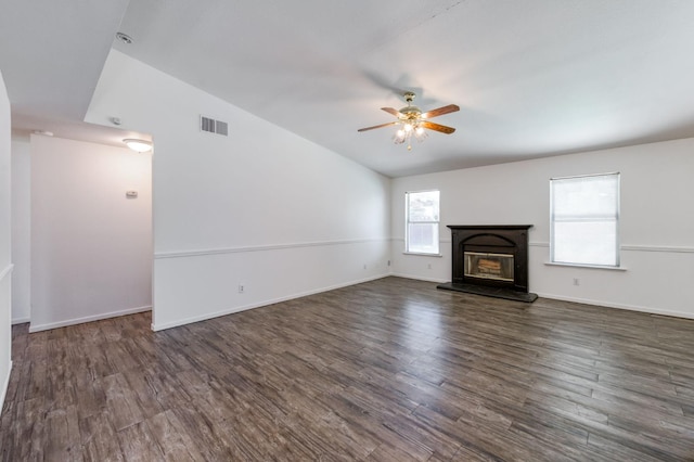 4665 W Yale Ave, Fresno, CA 93722 - unfurnished living room featuring ceiling fan, wood finished floors, and a glass covered fireplace