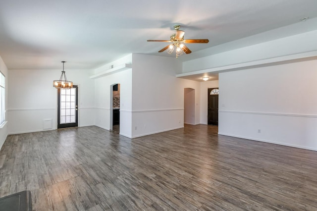 4665 W Yale Ave, Fresno, CA 93722 - unfurnished living room featuring a chandelier, a ceiling fan, arched walkways, and dark wood finished floors