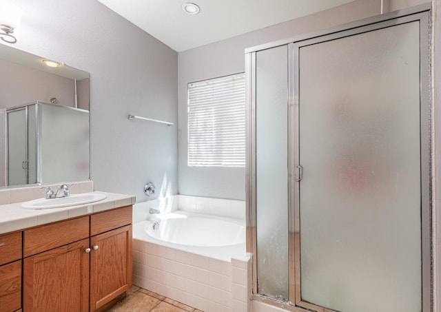 1734 Glen Oban Ln, Clovis, CA 93619 - bathroom featuring vanity, a shower stall, a garden tub, and tile patterned floors