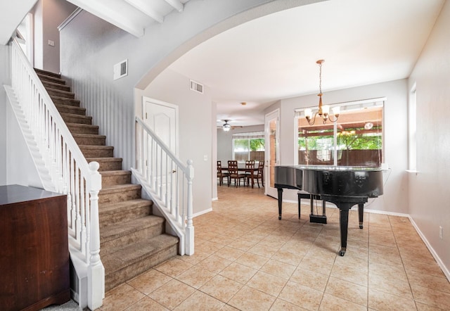 1734 Glen Oban Ln, Clovis, CA 93619 - stairway with arched walkways, tile patterned flooring, a chandelier, beam ceiling, and a ceiling fan