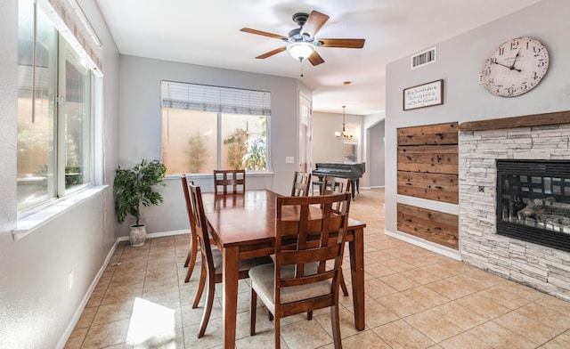 1734 Glen Oban Ln, Clovis, CA 93619 - dining room with plenty of natural light, ceiling fan, a fireplace, and light tile patterned floors
