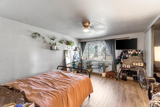 5098 E Ashlan Ave Unit 116, Fresno, CA 93727 - bedroom with wood finished floors and ceiling fan