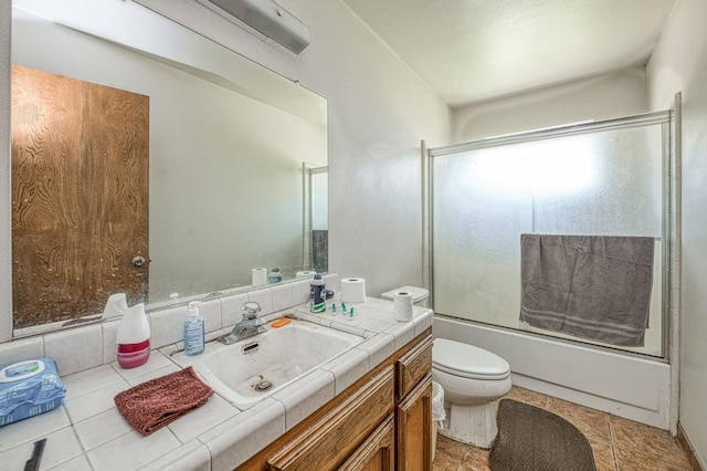 7815 N Sanders Ave, Clovis, CA 93619 - bathroom featuring vanity and bath / shower combo with glass door