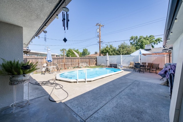 786 E Barstow Ave, Fresno, CA 93710 - view of pool featuring a patio, a fenced backyard, and outdoor dining area
