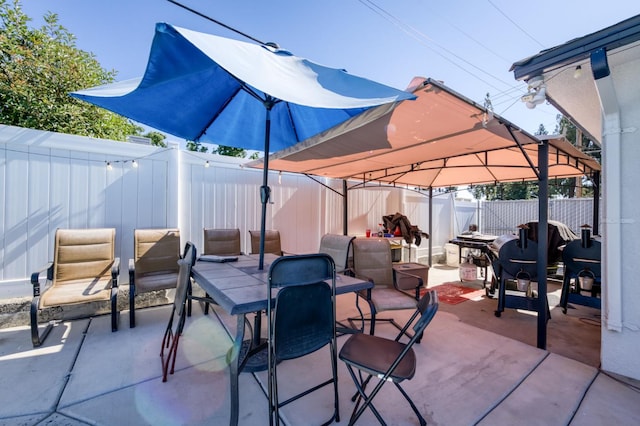 786 E Barstow Ave, Fresno, CA 93710 - fenced backyard with a gazebo, a patio area, and outdoor dining space