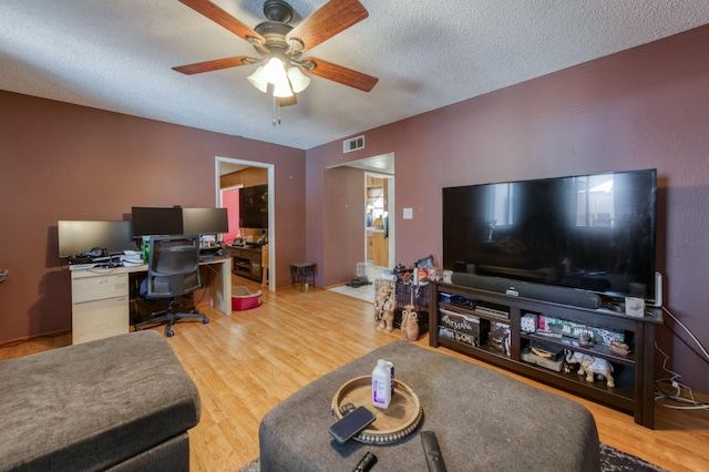 786 E Barstow Ave, Fresno, CA 93710 - office space with wood finished floors, a ceiling fan, and a textured ceiling