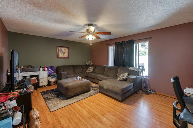 786 E Barstow Ave, Fresno, CA 93710 - living room with ceiling fan, wood finished floors, and a textured ceiling