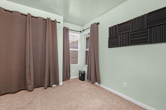3673 N Denali Ave, Fresno, CA 93727 - unfurnished bedroom with light carpet and baseboards