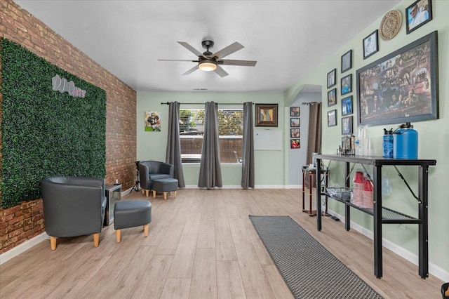 3673 N Denali Ave, Fresno, CA 93727 - workout room with brick wall, light wood-style flooring, ceiling fan, and arched walkways