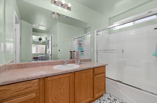 3673 N Denali Ave, Fresno, CA 93727 - full bath with connected bathroom, vanity, and enclosed tub / shower combo