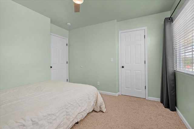 3673 N Denali Ave, Fresno, CA 93727 - bedroom with light carpet and ceiling fan