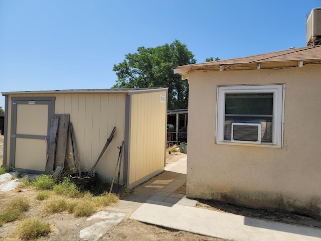 2453 S Willow, Fresno, CA 93725 - view of home's exterior featuring a storage shed and cooling unit