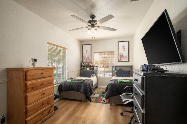 10223 N Price Ave, Fresno, CA 93730 - bedroom featuring light wood-style floors and ceiling fan