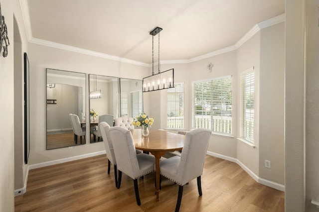 10223 N Price Ave, Fresno, CA 93730 - dining area with light wood-style flooring, crown molding, and a chandelier