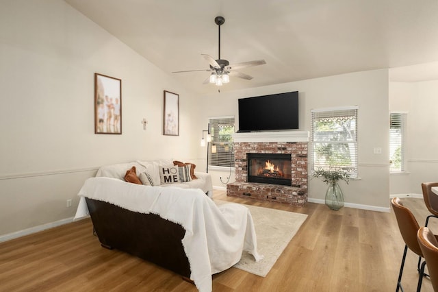 10223 N Price Ave, Fresno, CA 93730 - living room with light wood-style floors, healthy amount of natural light, ceiling fan, and a brick fireplace