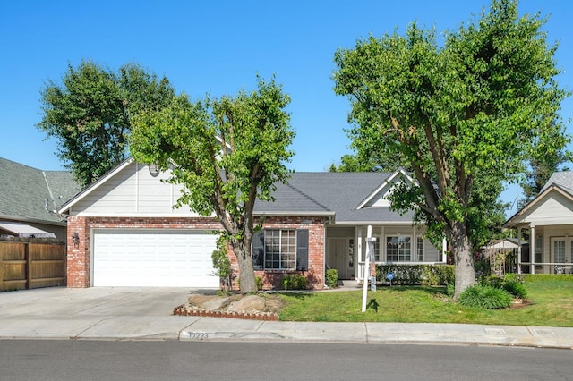 10223 N Price Ave, Fresno, CA 93730 - view of front of property featuring brick siding, concrete driveway, and an attached garage