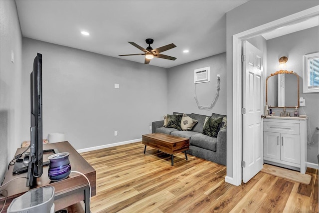 1408 S Hope Ave, Reedley, CA 93654 - living area featuring a ceiling fan, light wood finished floors, recessed lighting, and a wall mounted AC