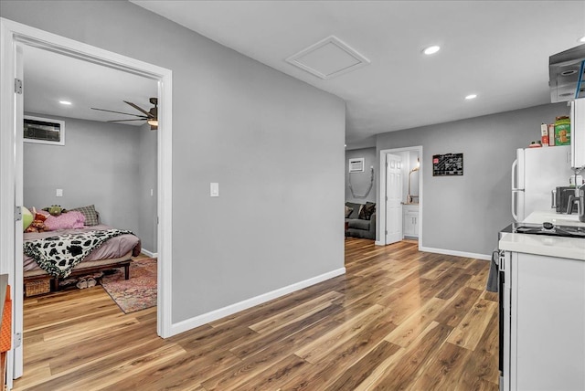 1408 S Hope Ave, Reedley, CA 93654 - hallway with wood finished floors, attic access, and recessed lighting