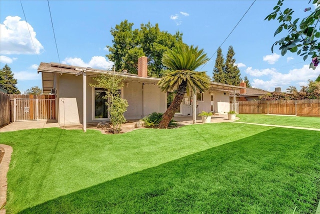 1408 S Hope Ave, Reedley, CA 93654 - rear view of house with stucco siding, a fenced backyard, a patio, and a chimney