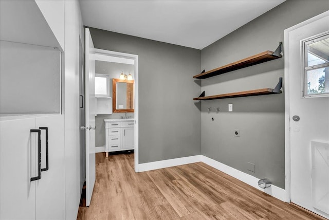 1408 S Hope Ave, Reedley, CA 93654 - washroom featuring electric dryer hookup, light wood finished floors, and washer hookup