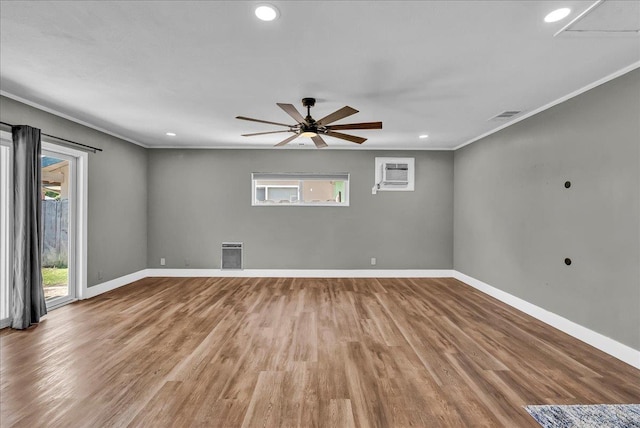 1408 S Hope Ave, Reedley, CA 93654 - empty room featuring ornamental molding, wood finished floors, a wall mounted air conditioner, ceiling fan, and recessed lighting