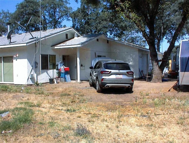 34937 Bronco Ln, Yokuts Valley, CA 93675 - view of front of house with stucco siding