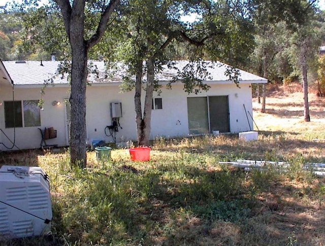 34937 Bronco Ln, Yokuts Valley, CA 93675 - rear view of house featuring stucco siding