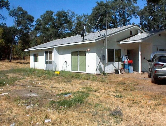 34937 Bronco Ln, Yokuts Valley, CA 93675 - view of front facade with stucco siding