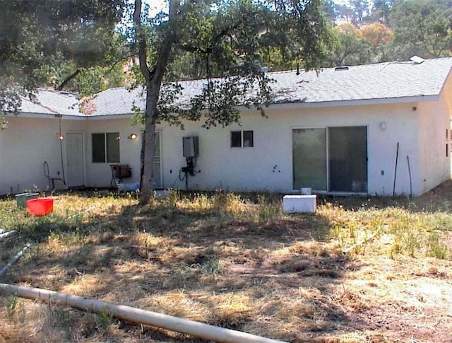 34937 Bronco Ln, Yokuts Valley, CA 93675 - back of property with stucco siding