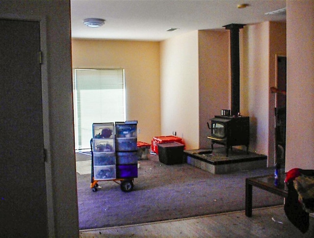 34937 Bronco Ln, Yokuts Valley, CA 93675 - interior space featuring a wood stove