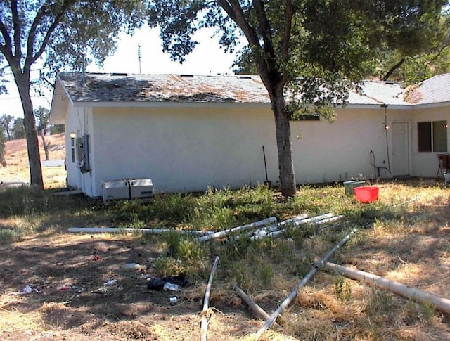 34937 Bronco Ln, Yokuts Valley, CA 93675 - view of home's exterior featuring stucco siding