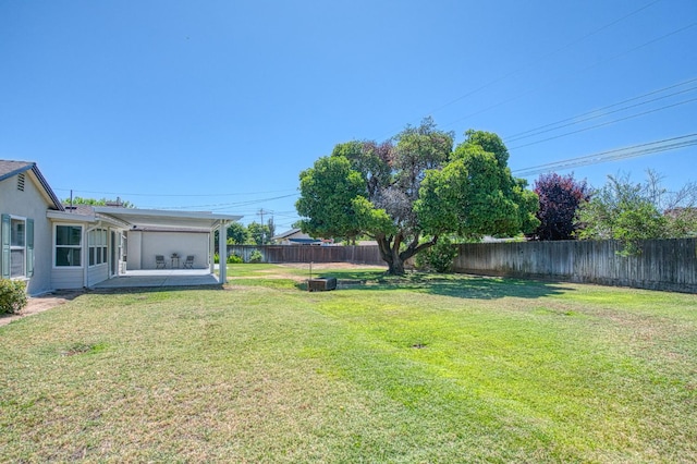 927 W Pico Ave, Fresno, CA 93705 - fenced backyard with a patio area