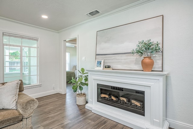 927 W Pico Ave, Fresno, CA 93705 - living area with ornamental molding, wood finished floors, and a glass covered fireplace
