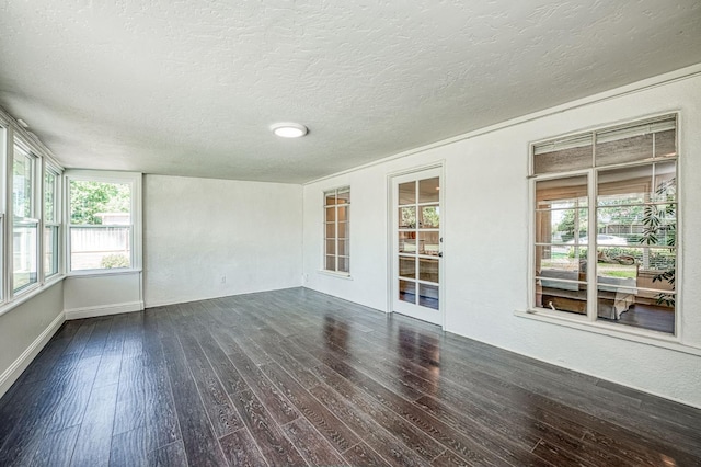 927 W Pico Ave, Fresno, CA 93705 - unfurnished sunroom with wood finished floors, a textured ceiling, and healthy amount of natural light