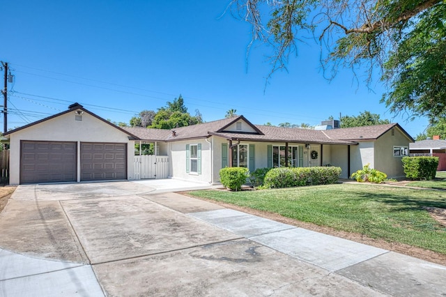927 W Pico Ave, Fresno, CA 93705 - single story home with stucco siding, a garage, and driveway