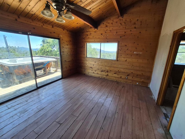 55766 Quail Hollow Ct, North Fork, CA 93643 - spare room featuring wood ceiling, plenty of natural light, dark wood-type flooring, a ceiling fan, and wood walls