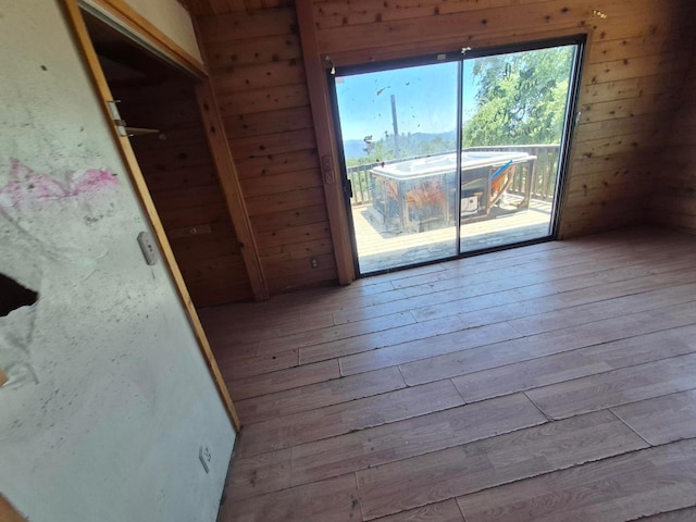 55766 Quail Hollow Ct, North Fork, CA 93643 - spare room featuring wood-type flooring and wood walls