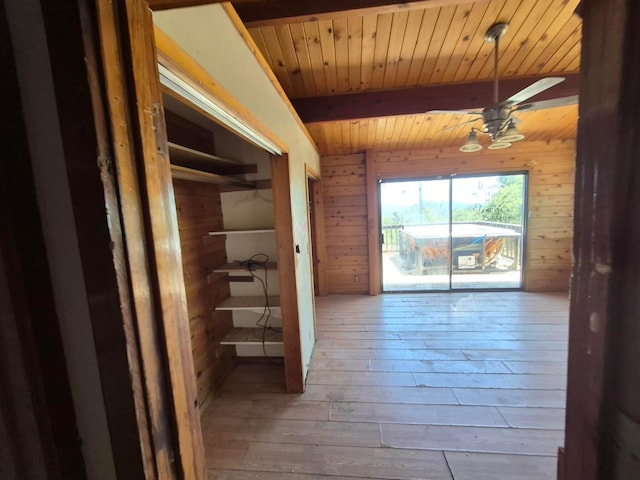 55766 Quail Hollow Ct, North Fork, CA 93643 - corridor with wood walls, a wooden ceiling with exposed beams, and hardwood / wood-style flooring